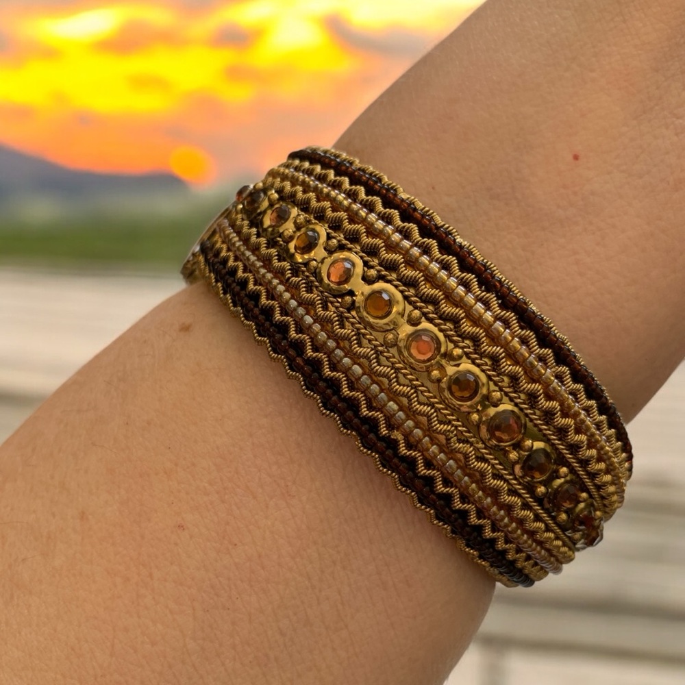Elegant Gold and Brown Clamp Bracelet with Amber Color Accents